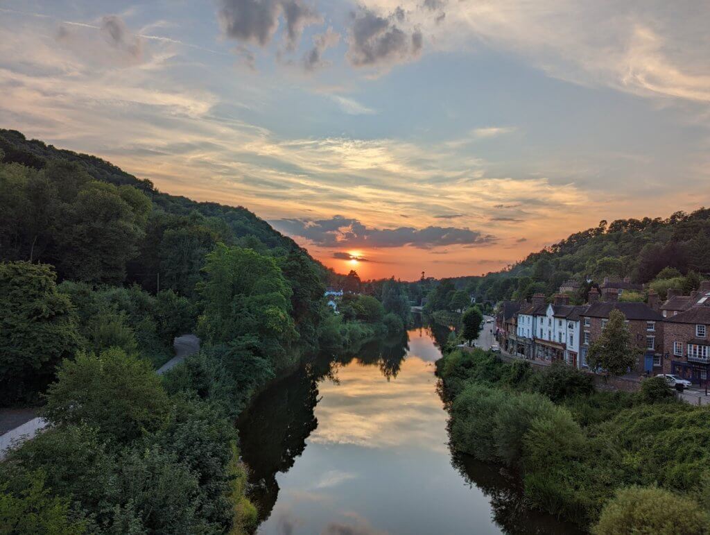 A photo of the sun setting, taken from the Iron Bridge looking towards Coalbrookdale, Telford